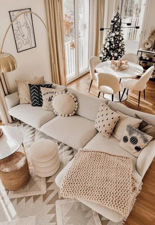 Elegant neutral-toned lounge featuring a compact dining nook