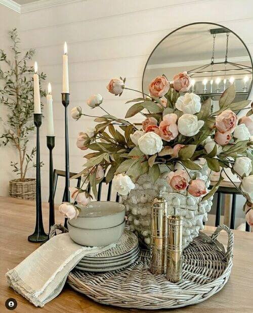 Textured rattan tray layered with eclectic treasures