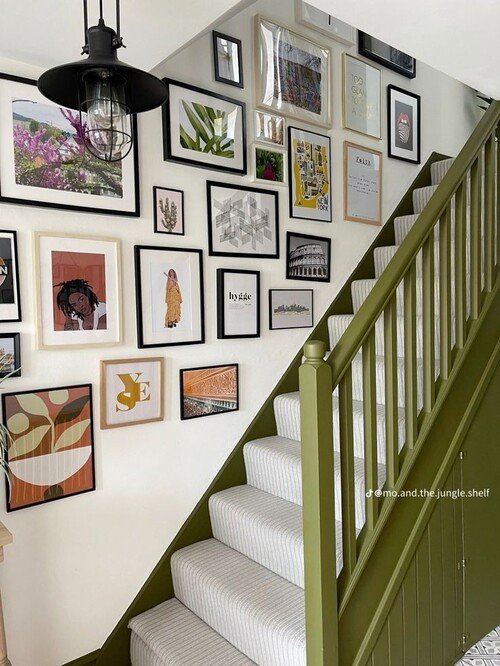 An olive green railing paired with a bold mix of art styles