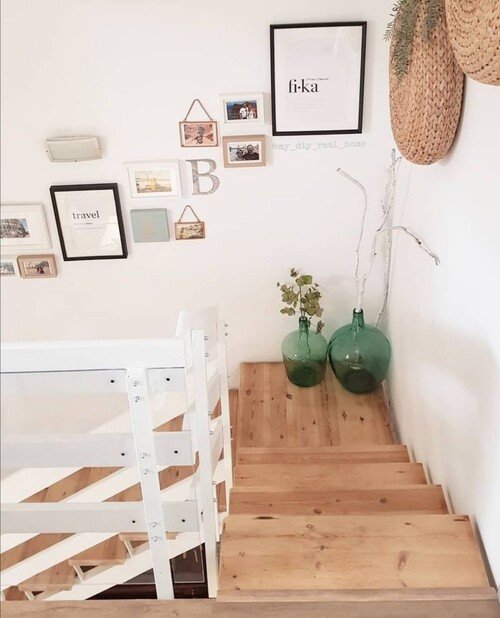 A curated mix of small art and family photos in assorted frames