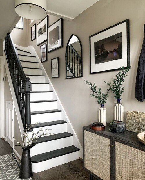 Black frames paired with an arched mirror