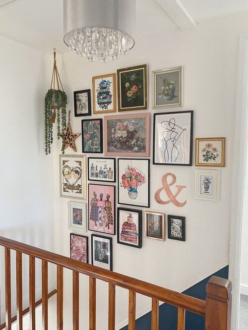 A feminine gallery wall with glam accents