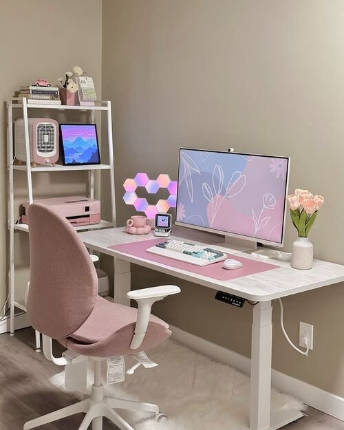 Elevate your workspace with chic and modern pink desk accents