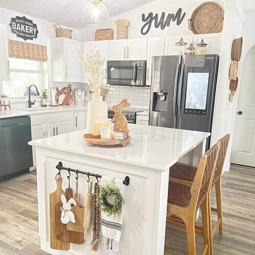 A charming arrangement of bunny decor, artisan ceramics, and simple fresh flowers