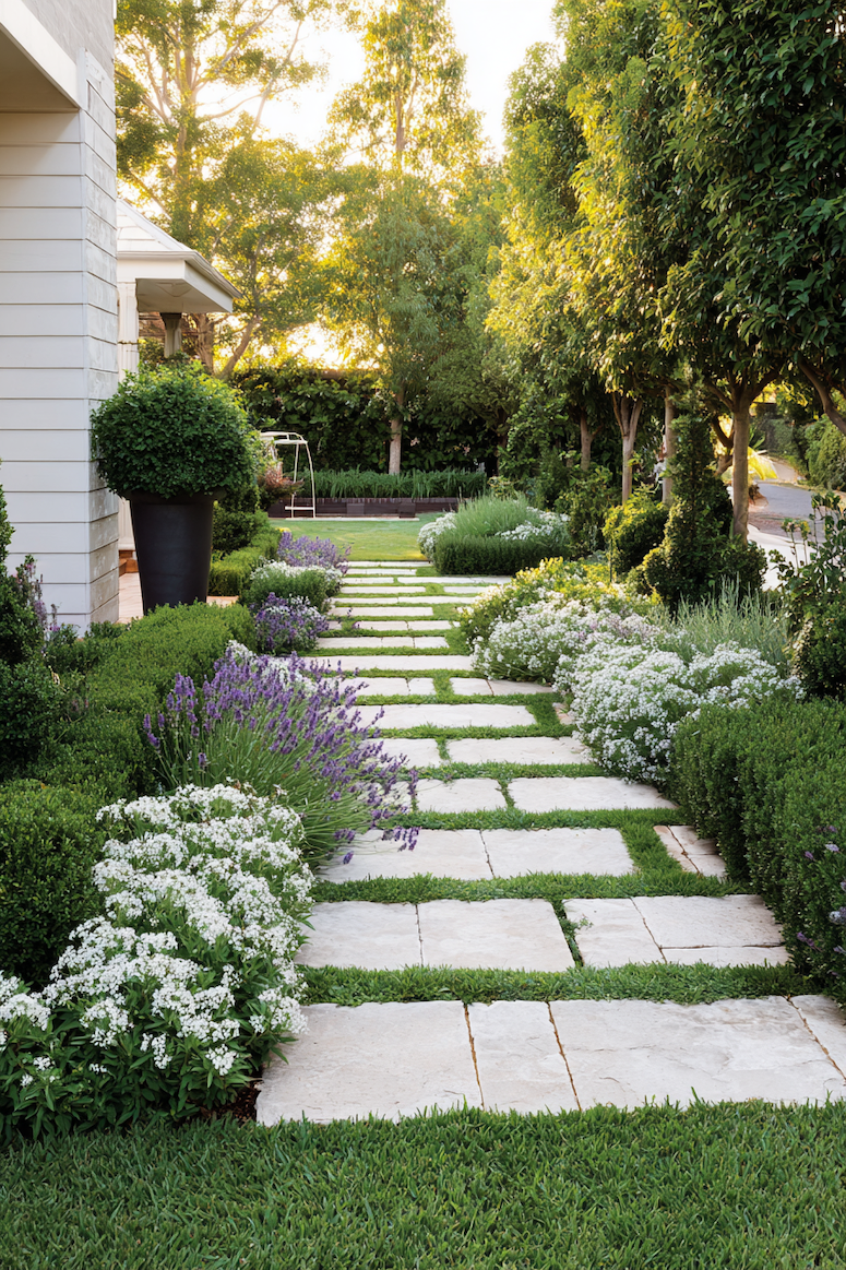 Create a serene garden walk with a stone pathway lined by fragrant lavender borders