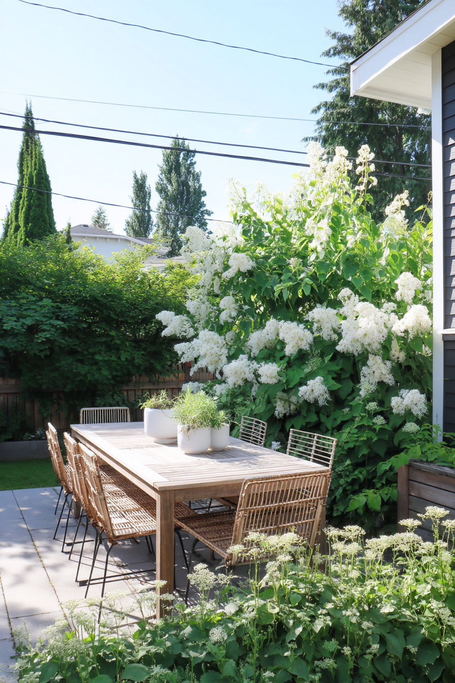 Create a serene retreat with a lush green oasis featuring elegant white hydrangeas